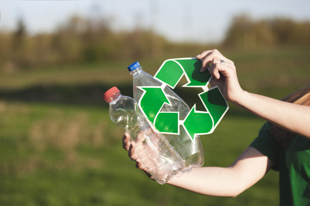 recycle-background-with-woman-holding-recycle-sign